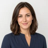 Clara's Slack avatar: a generated portrait of a smiling woman with shoulder-length brown hair